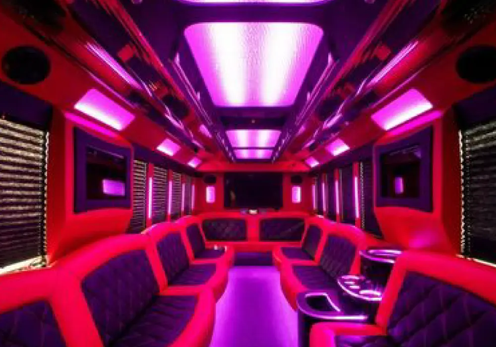 inside a red and black interior of a party bus