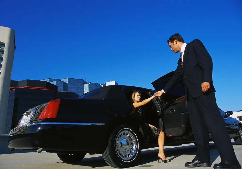 a man and a woman getting out of a car