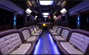 View down the aisle of the 35 passenger party bus, with fiber-optic ceiling lighting and wraparound seating