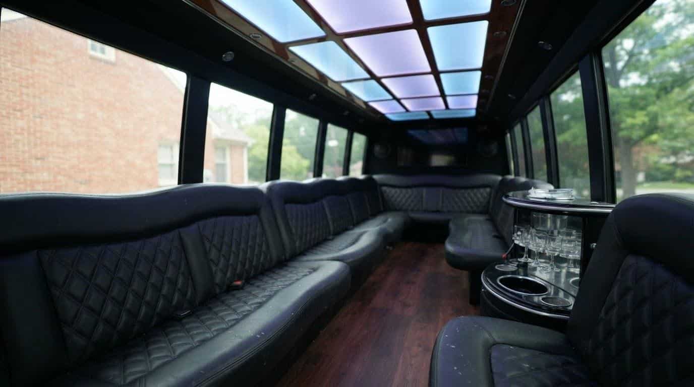 Empty luxury party bus interior with leather seating ready for airport transportation group booking